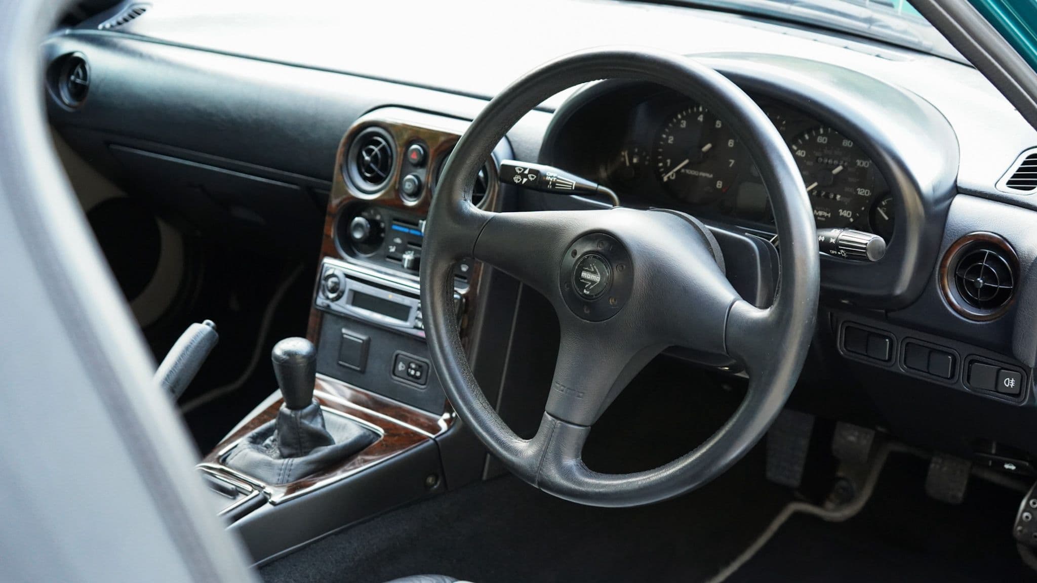 1998 Mazda MX-5 Berkeley Edition interior showing the dashboard steering wheel and centre console.