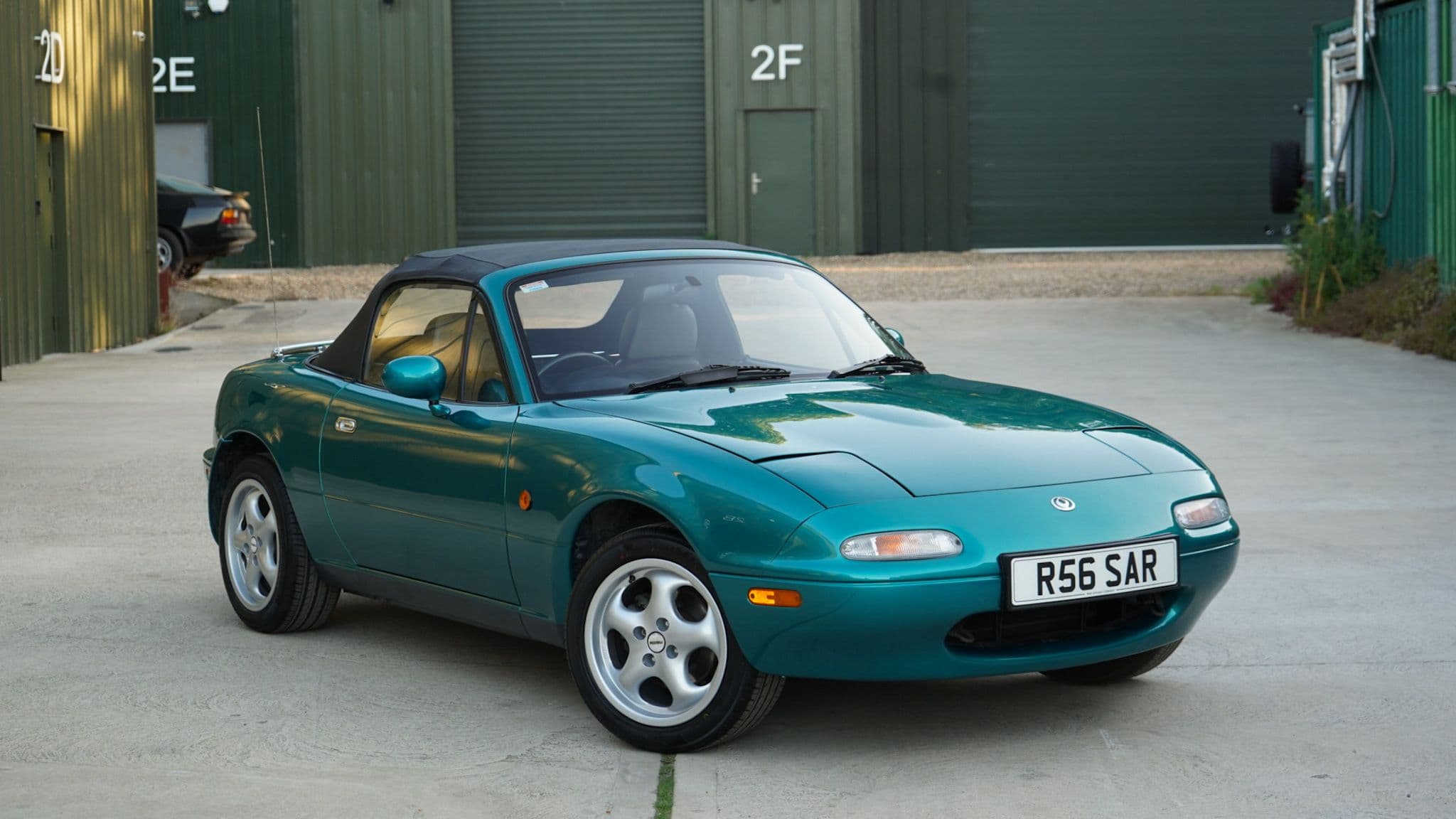 Green 1998 Mazda MX-5 Berkeley Edition in a wide front three-quarter view.