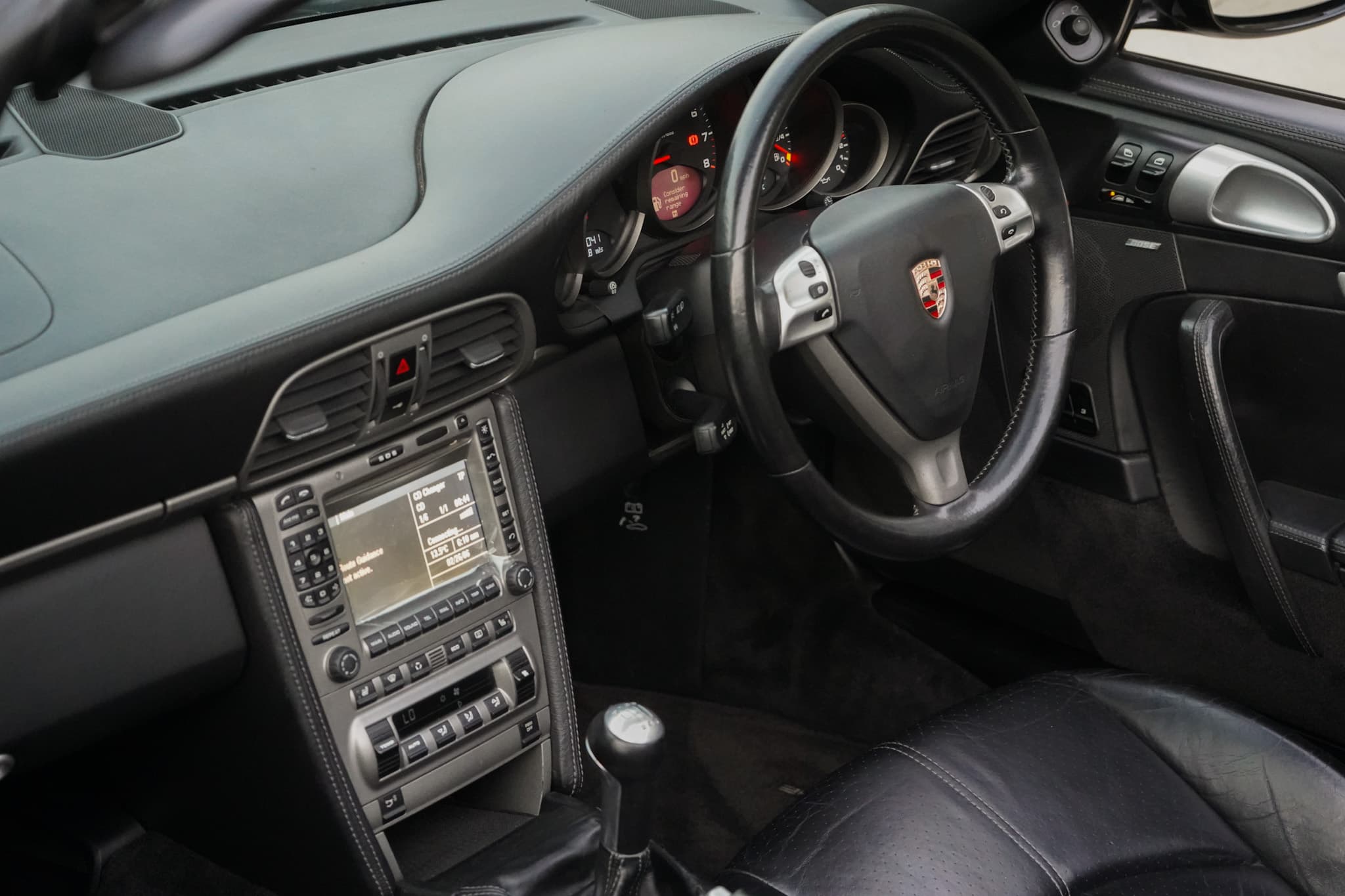 2006 Porsche 911 (997) Carrera Cabriolet interior showing the dashboard and centre console.