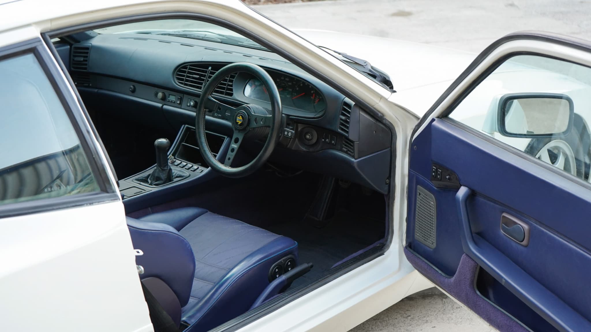 Porsche 944 S2 3.0L interior showing the blue interior door open.