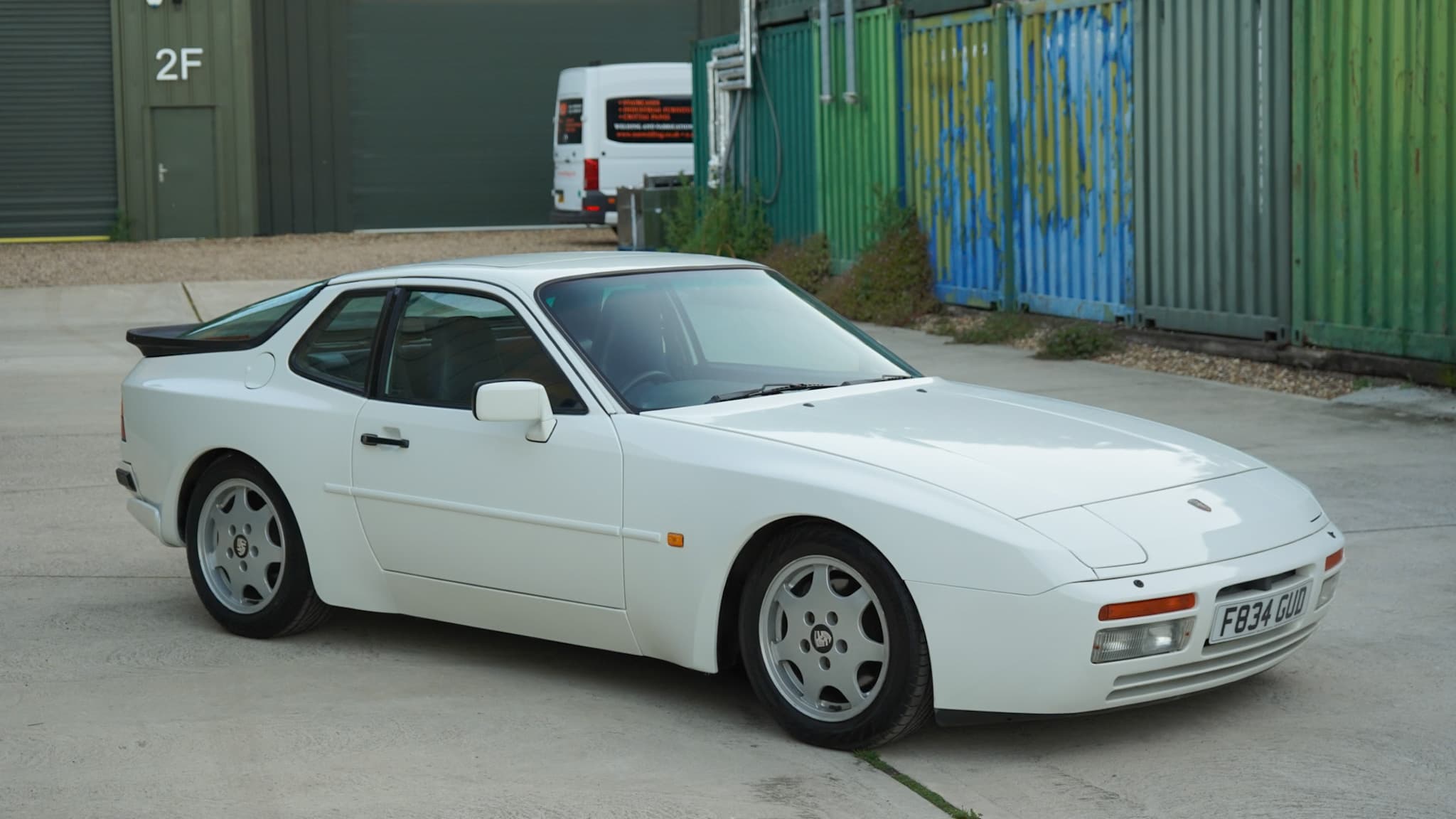 White Porsche 944 S2 3.0L in a wide front three-quarter view.