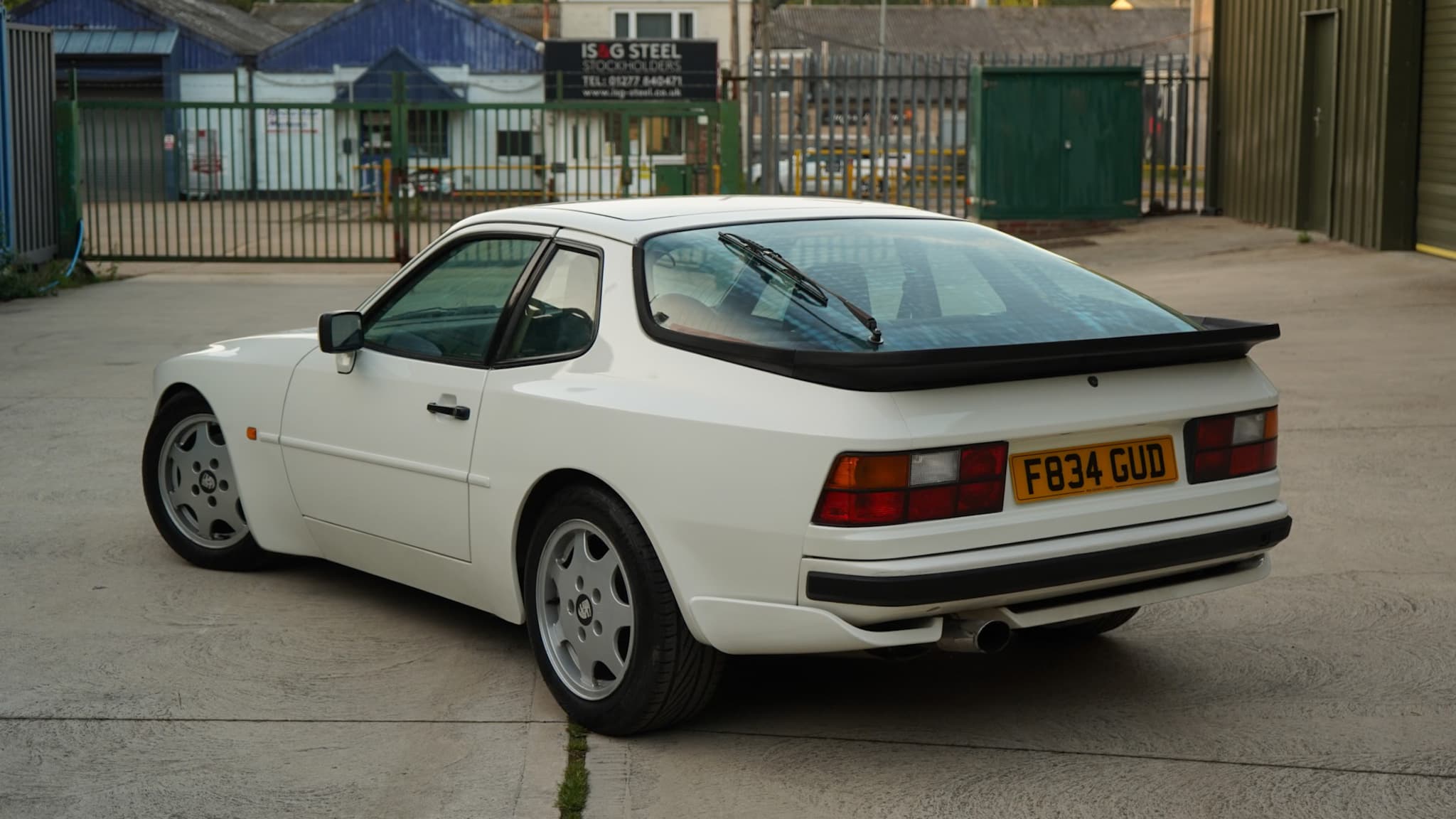 White Porsche 944 S2 3.0L in a high-angle rear three-quarter view.