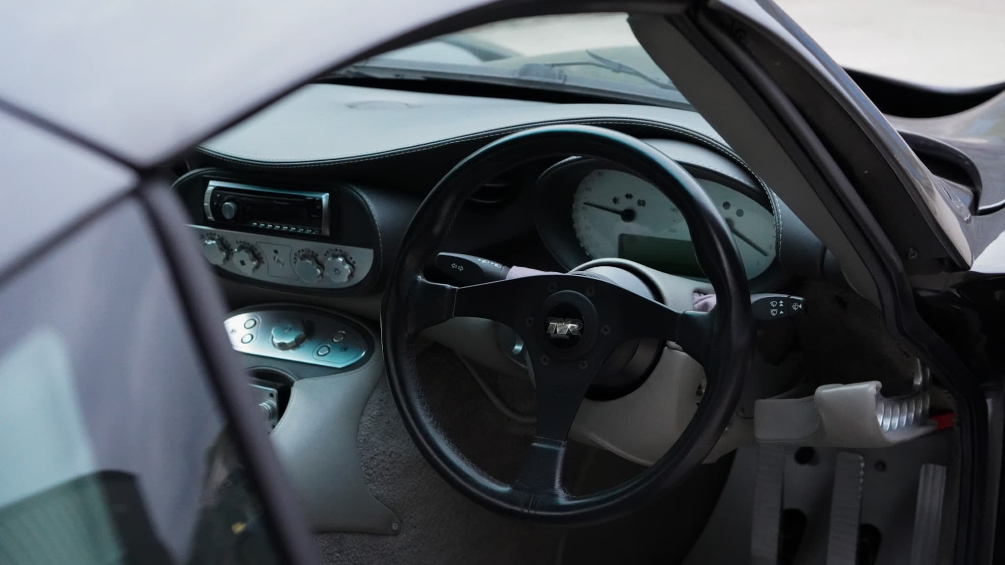 TVR Tuscan Mk3 interior showing the steering wheel and dashboard.