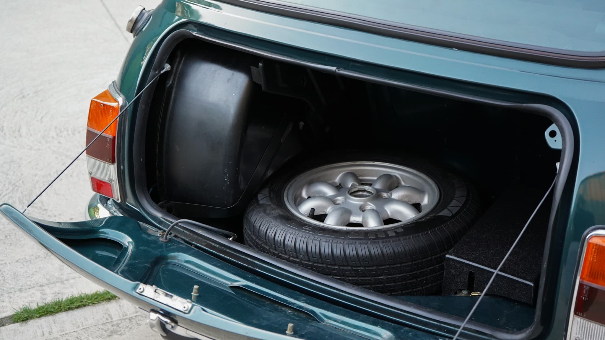 1993 Rover Mini Automatic interior showing the boot interior with spare wheel.
