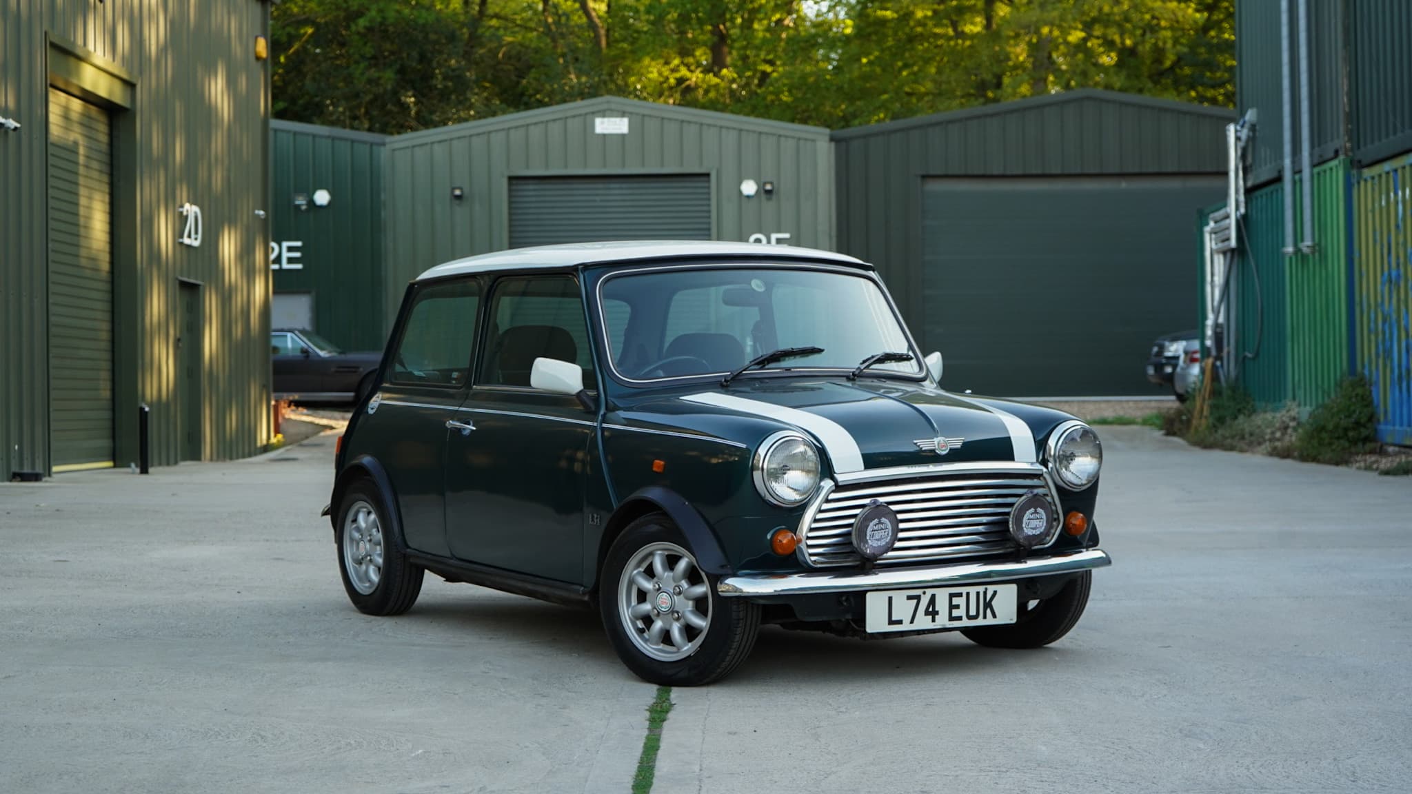 Dark green with white roof 1993 Rover Mini Automatic in a front three-quarter view.