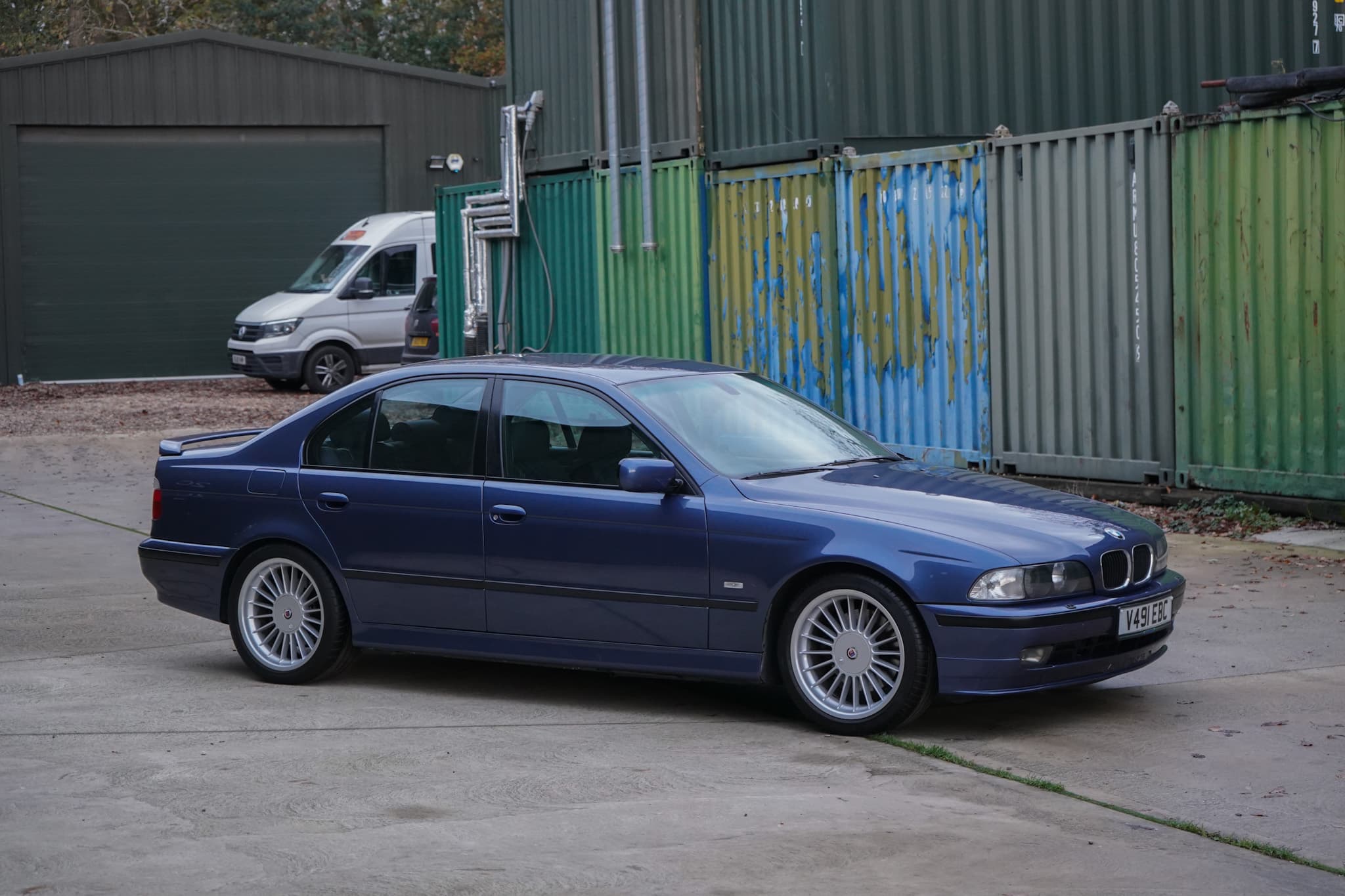 Blue 1999 BMW E39 Alpina B10 3.3 Manual in a wide side profile.