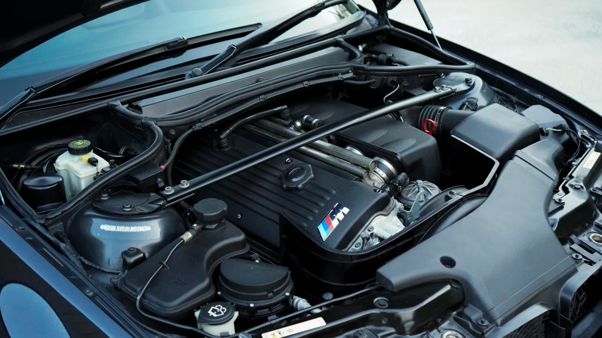 Black 2002 BMW M3 (E46) Manual showing the engine bay.