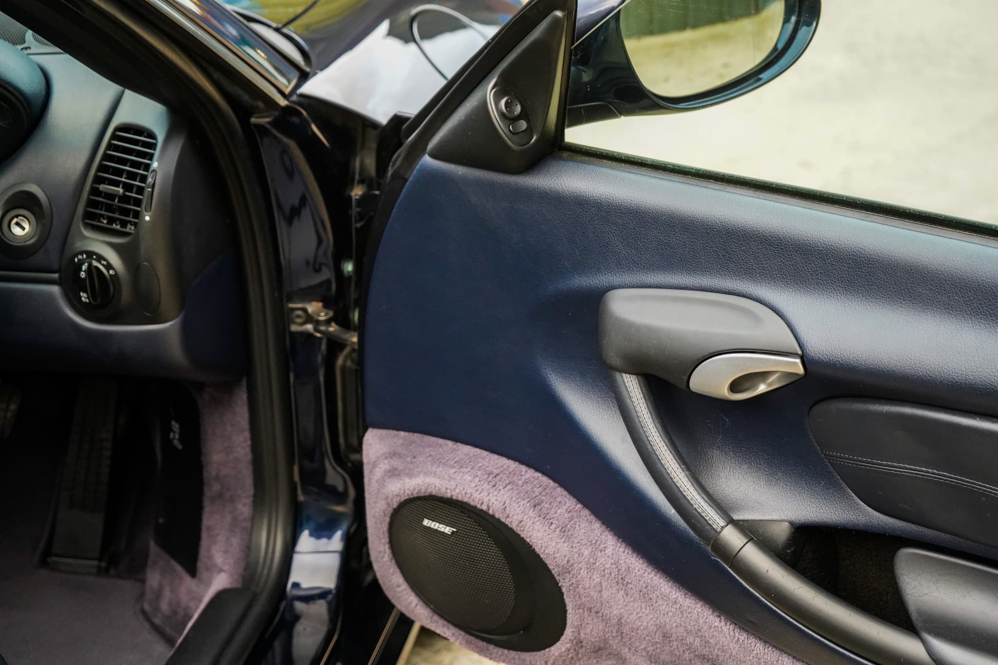 2003 Porsche Boxster (986) interior showing the door card close-up.