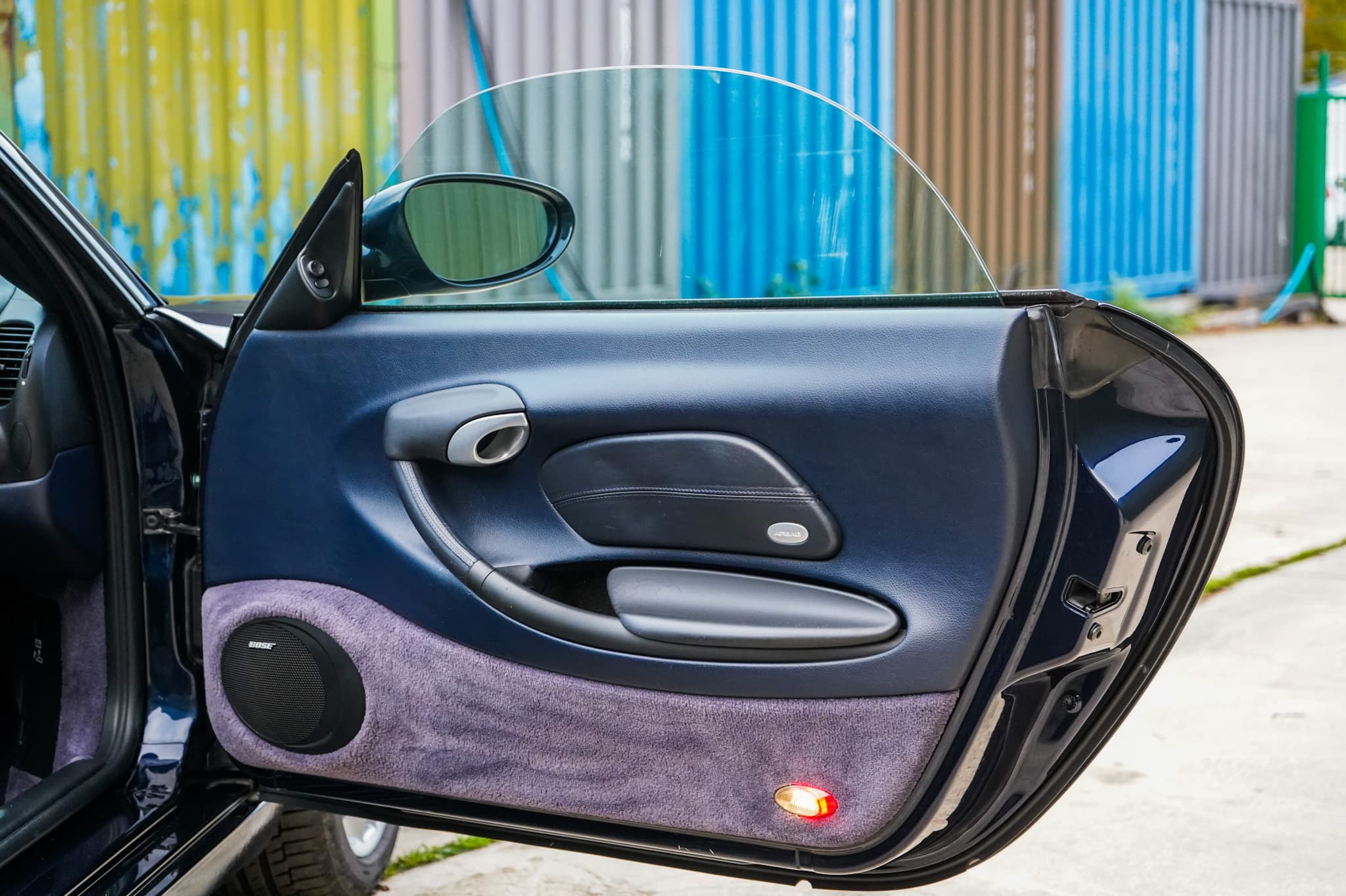 2003 Porsche Boxster (986) interior showing the door card open.
