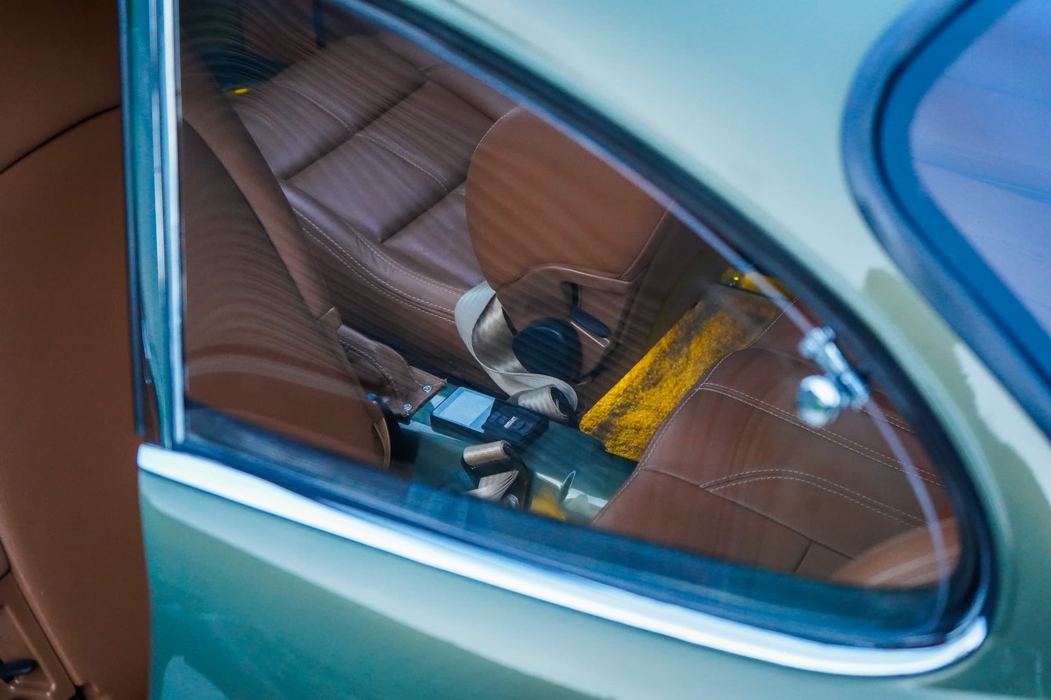 Volkswagen Karmann Ghia Type 14 Restomod interior showing the rear side window and interior detail.