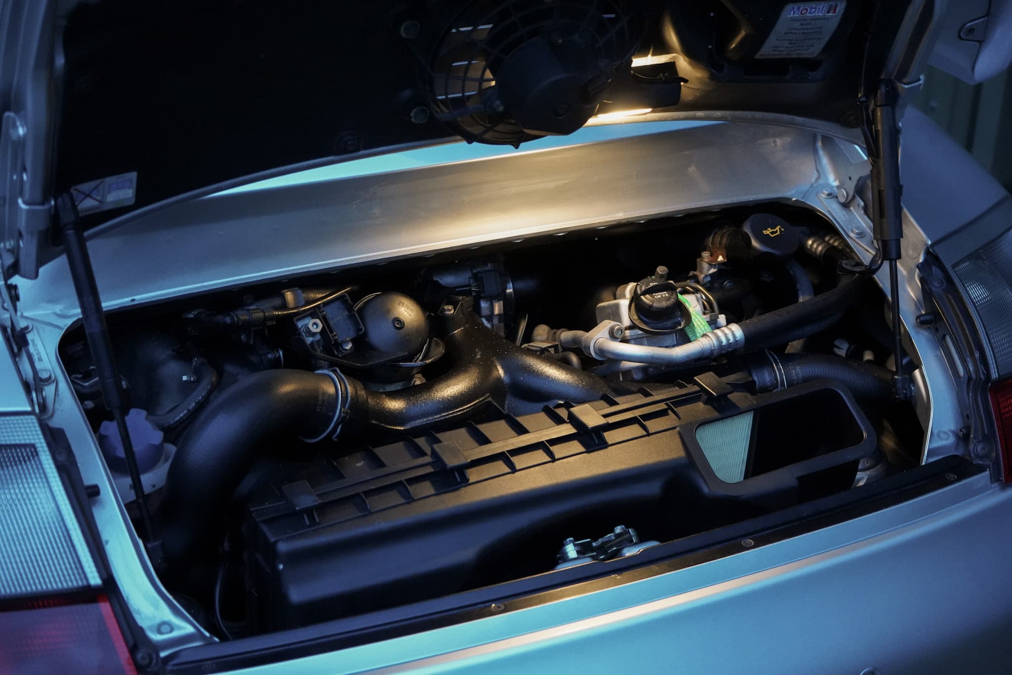 Silver Porsche 911 (996) Turbo X50 Pack showing the open engine bay.