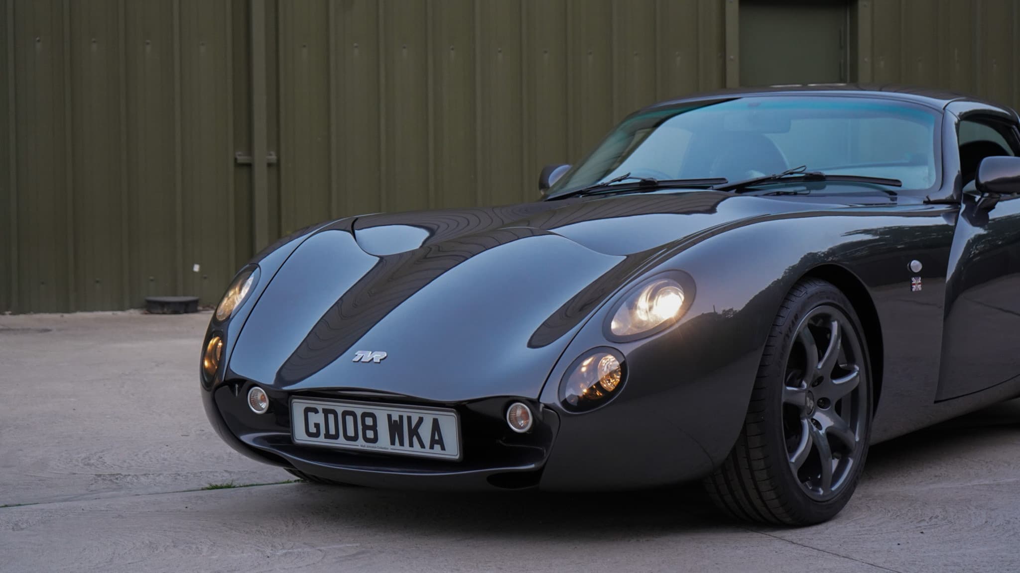 Dark grey TVR Tuscan Mk3 in a front three-quarter view.