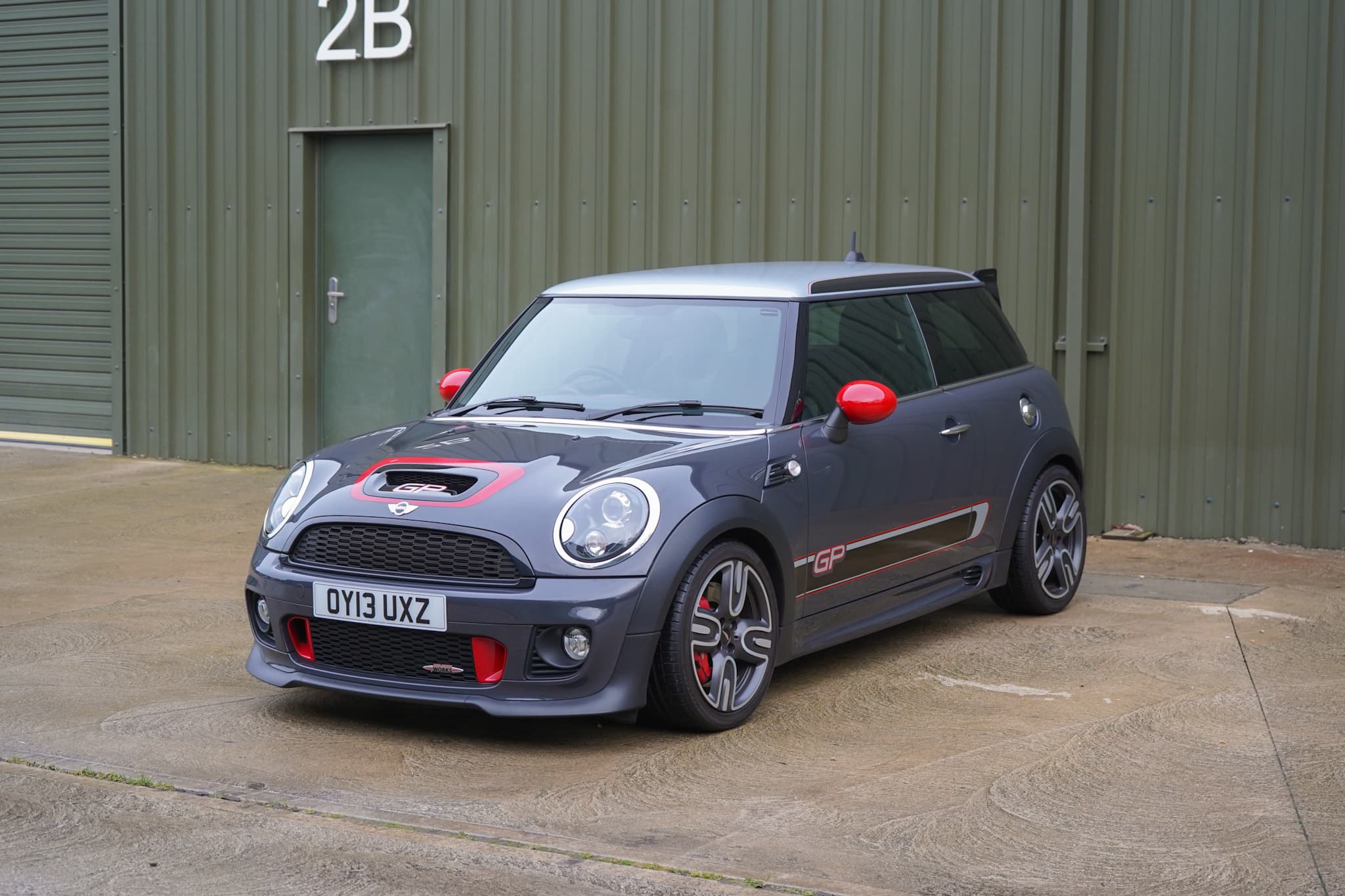 Thunder Grey Metallic 2013 MINI John Cooper Works GP2 (R56) in a front three-quarter view.