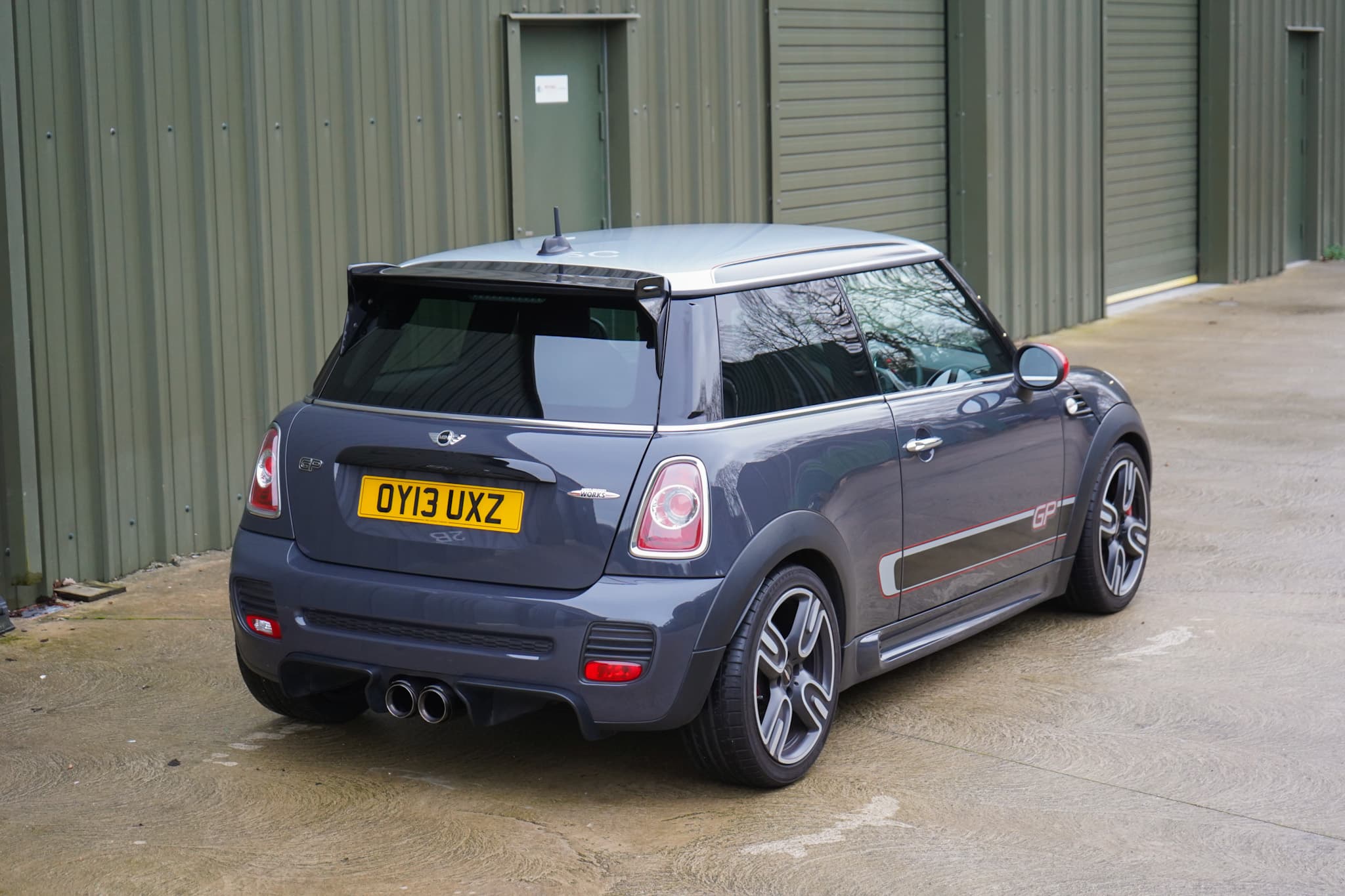 Thunder Grey Metallic 2013 MINI John Cooper Works GP2 (R56) in a rear three-quarter view.