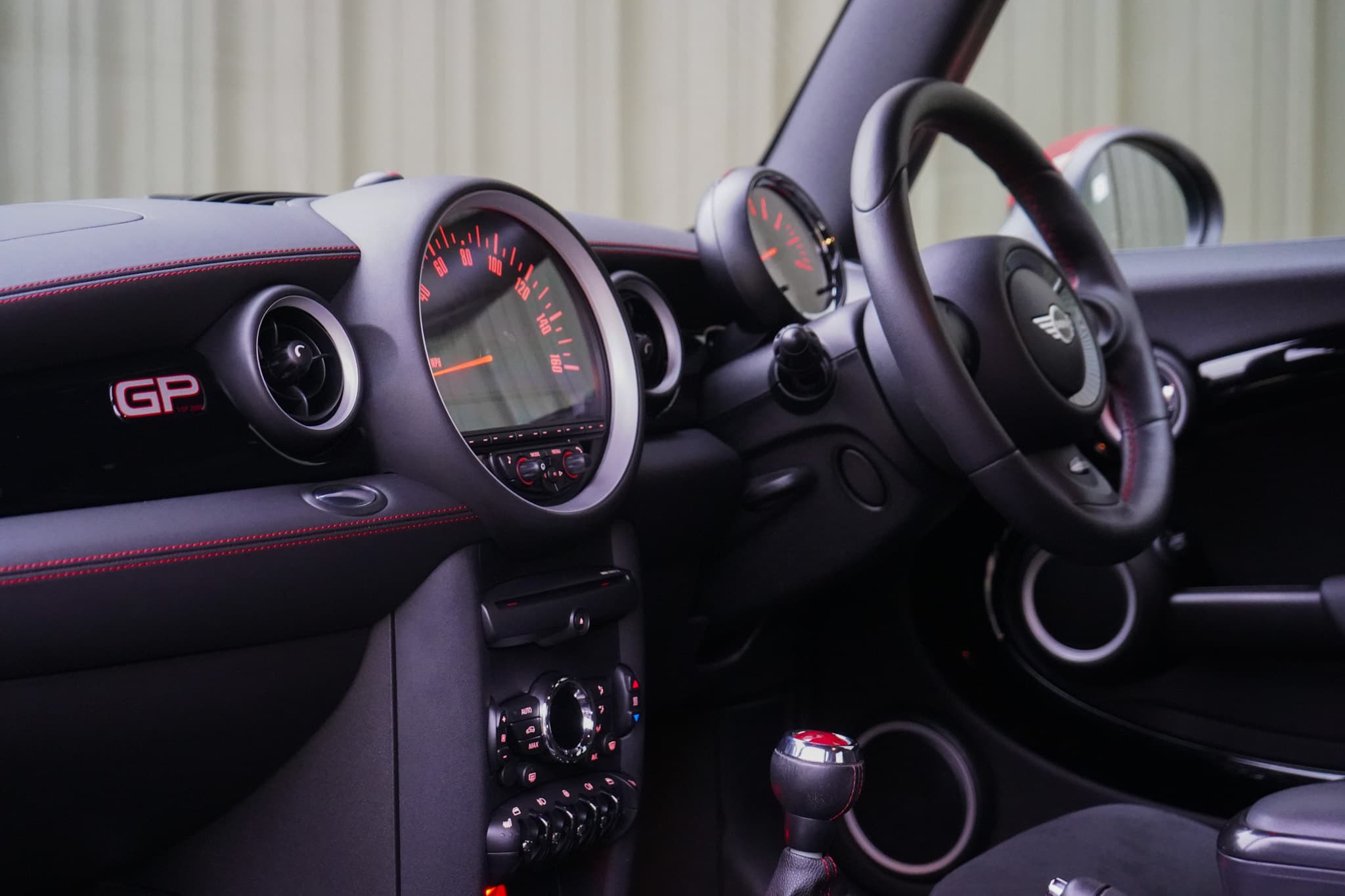 2013 MINI John Cooper Works GP2 (R56) interior showing the steering wheel dashboard and cabin.