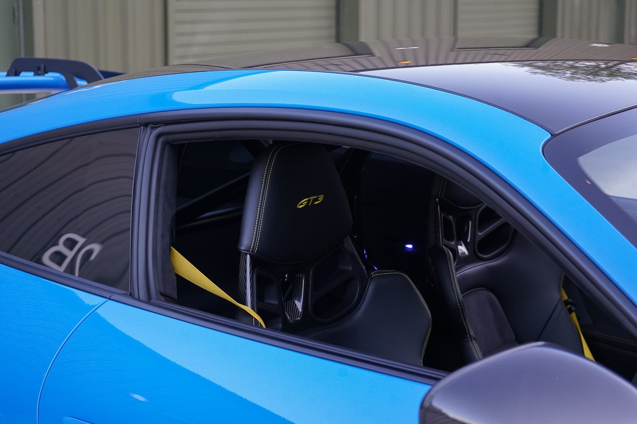2022 Porsche 911 (992) GT3 side window and front-seat interior detail.