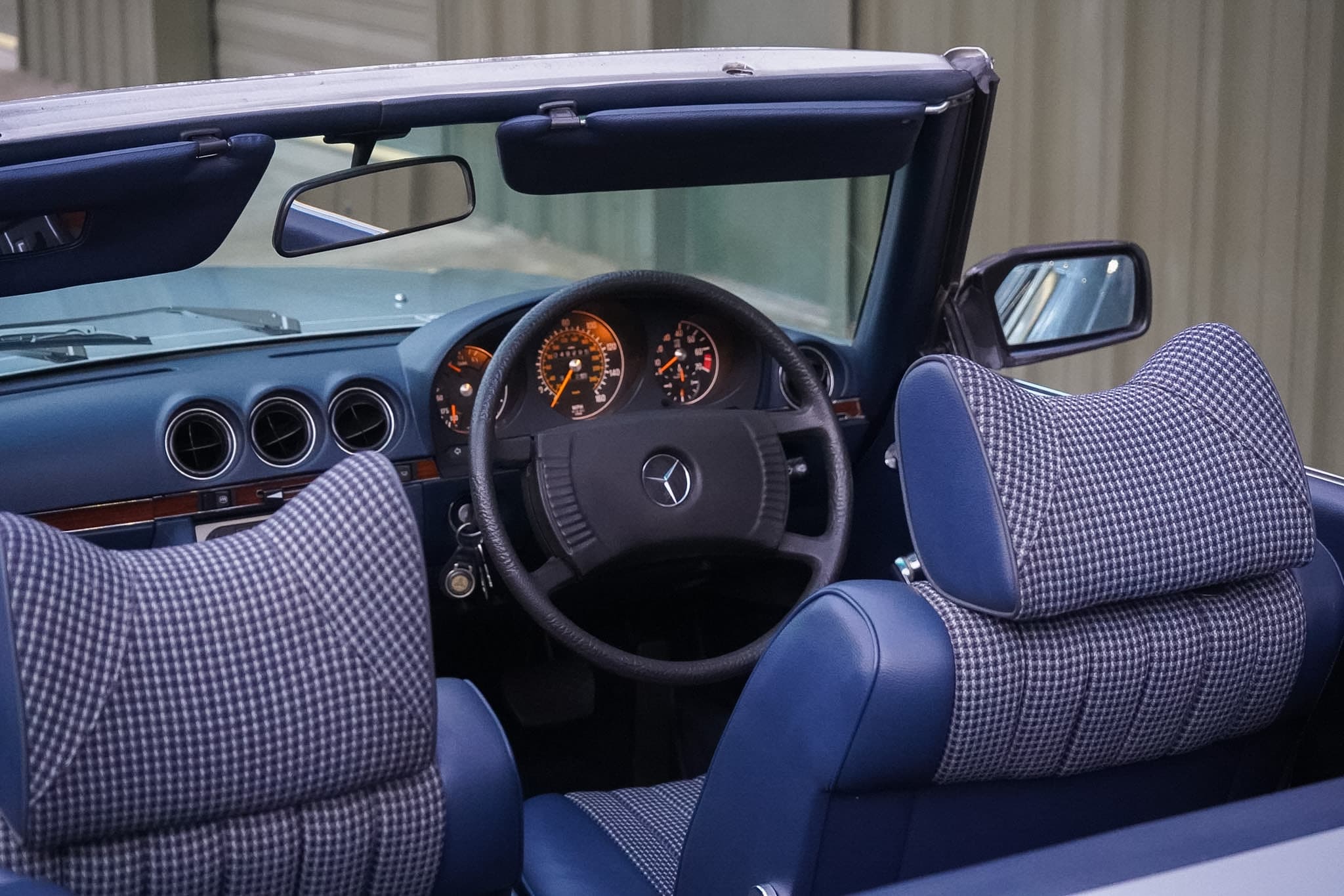 Mercedes-Benz 350 SL (R107) open-cabin dashboard and steering wheel view.