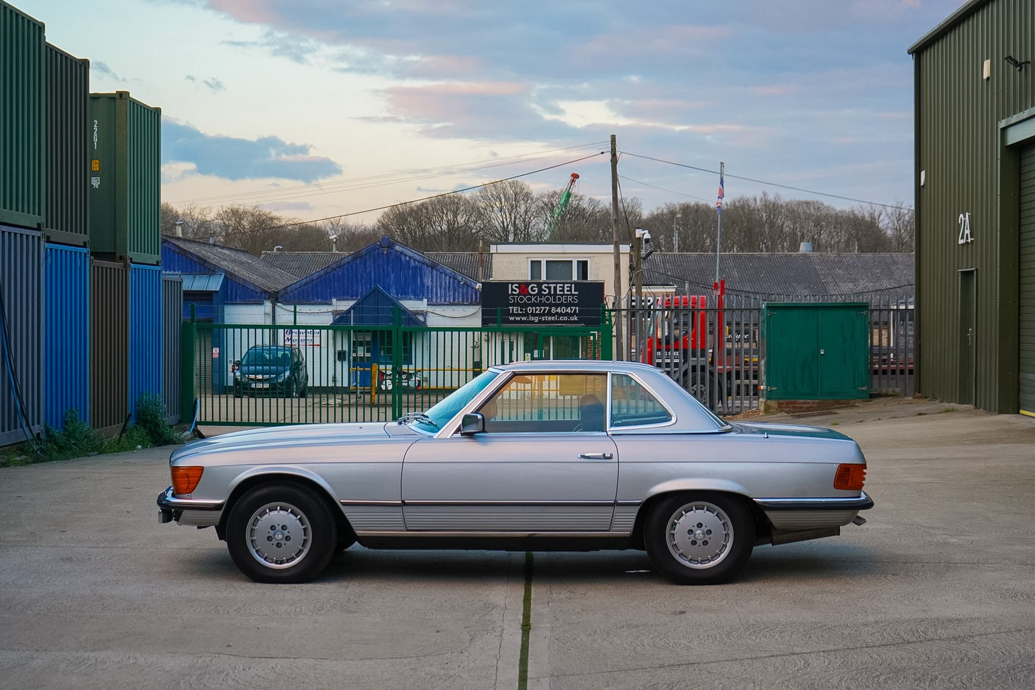 Silver Mercedes-Benz 350 SL (R107) side profile with hardtop fitted.