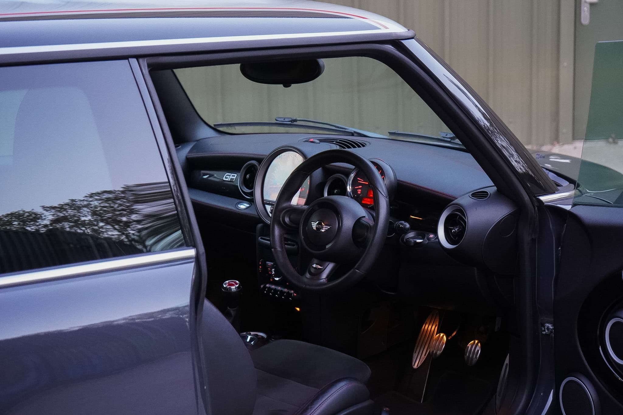 MINI GP2 (R56) dashboard and steering wheel through the open side window.