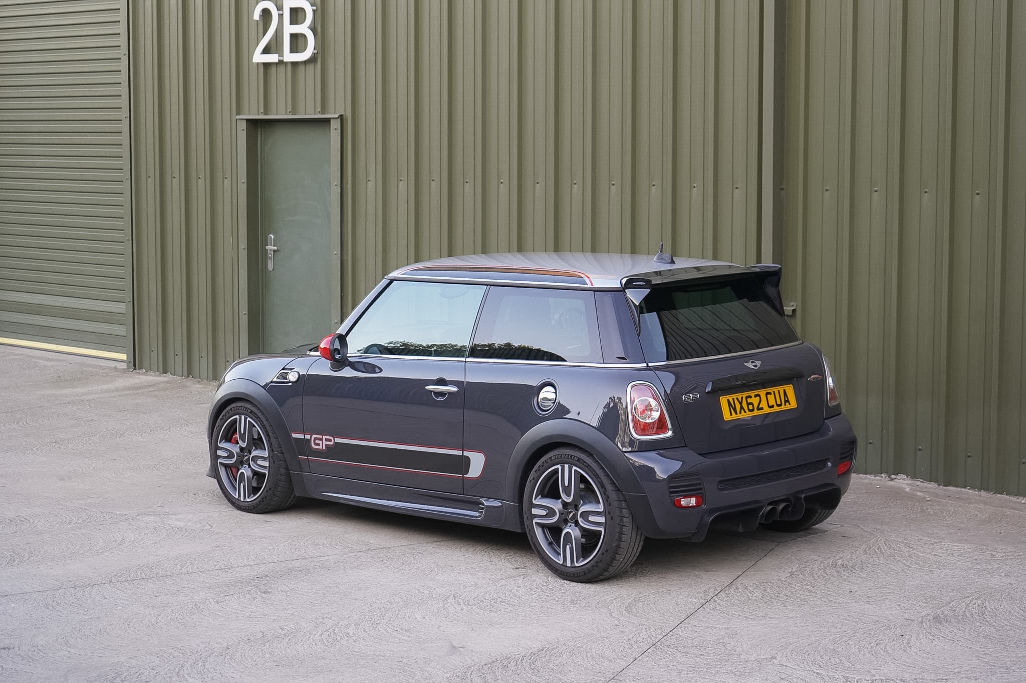 Dark grey MINI GP2 (R56) rear three-quarter view.