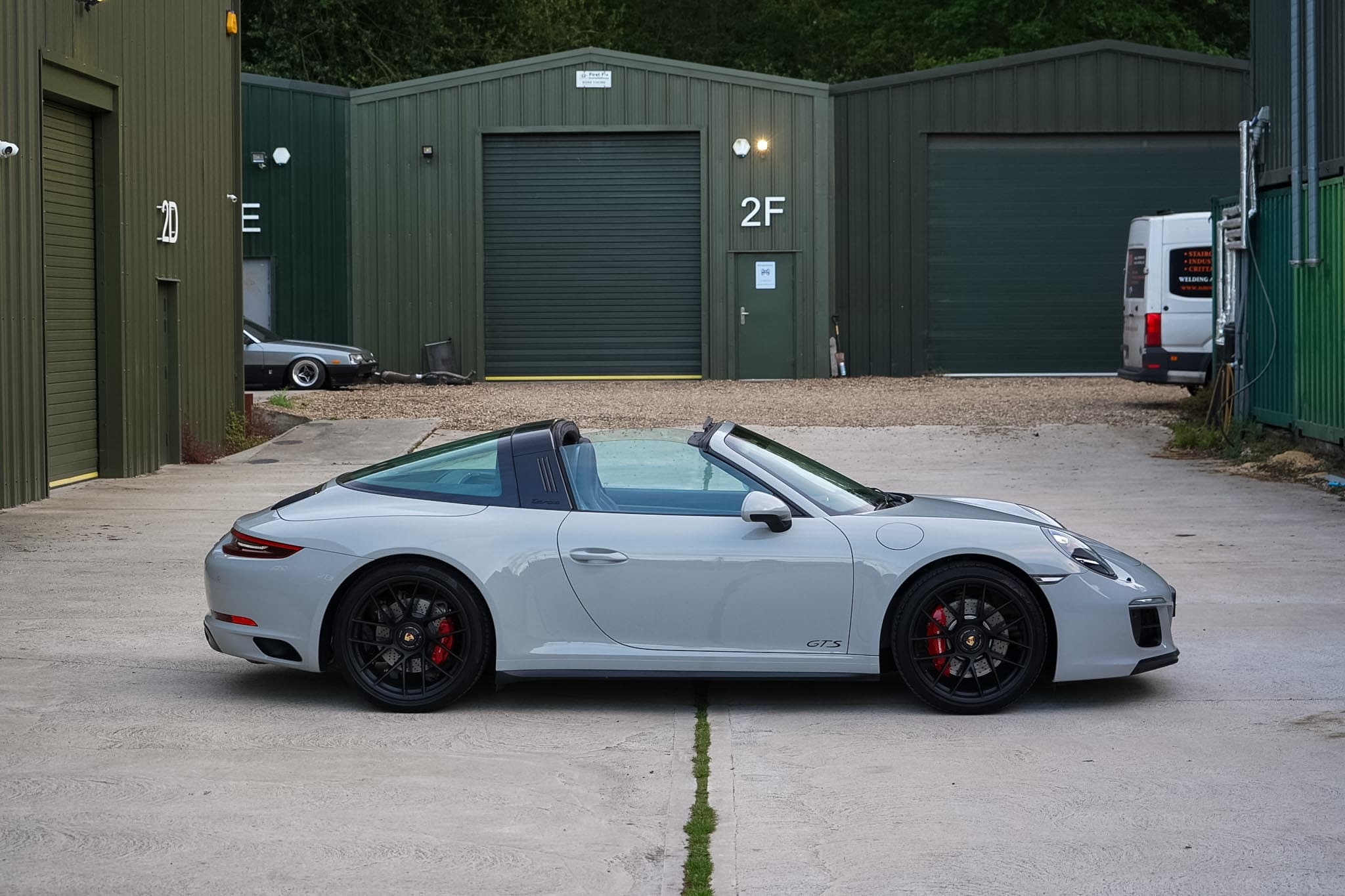 Silver 2018 Porsche 911 (991.2) Targa 4 GTS full side profile.