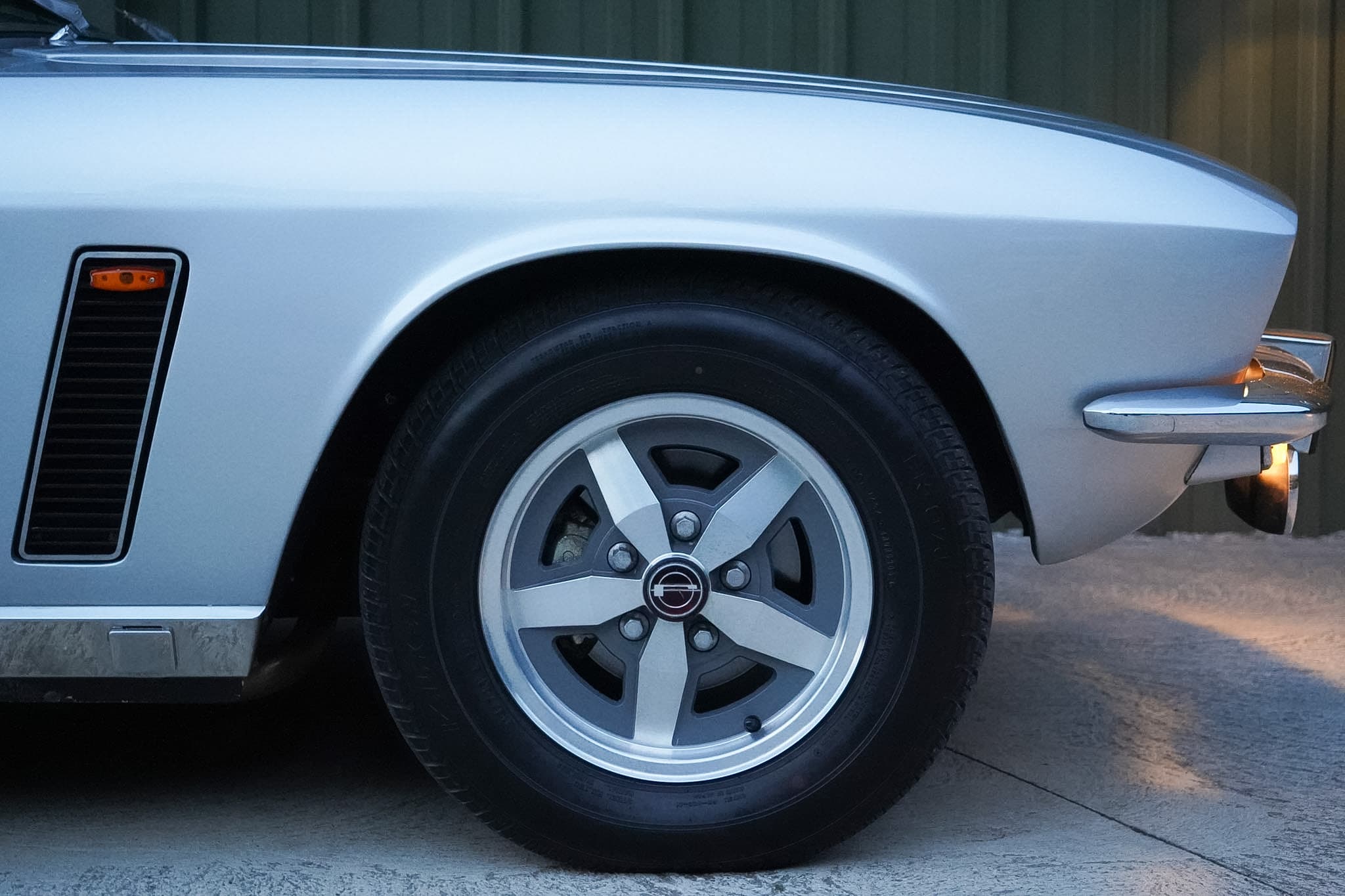 Silver Jensen Interceptor Mk III front wheel and wing detail.