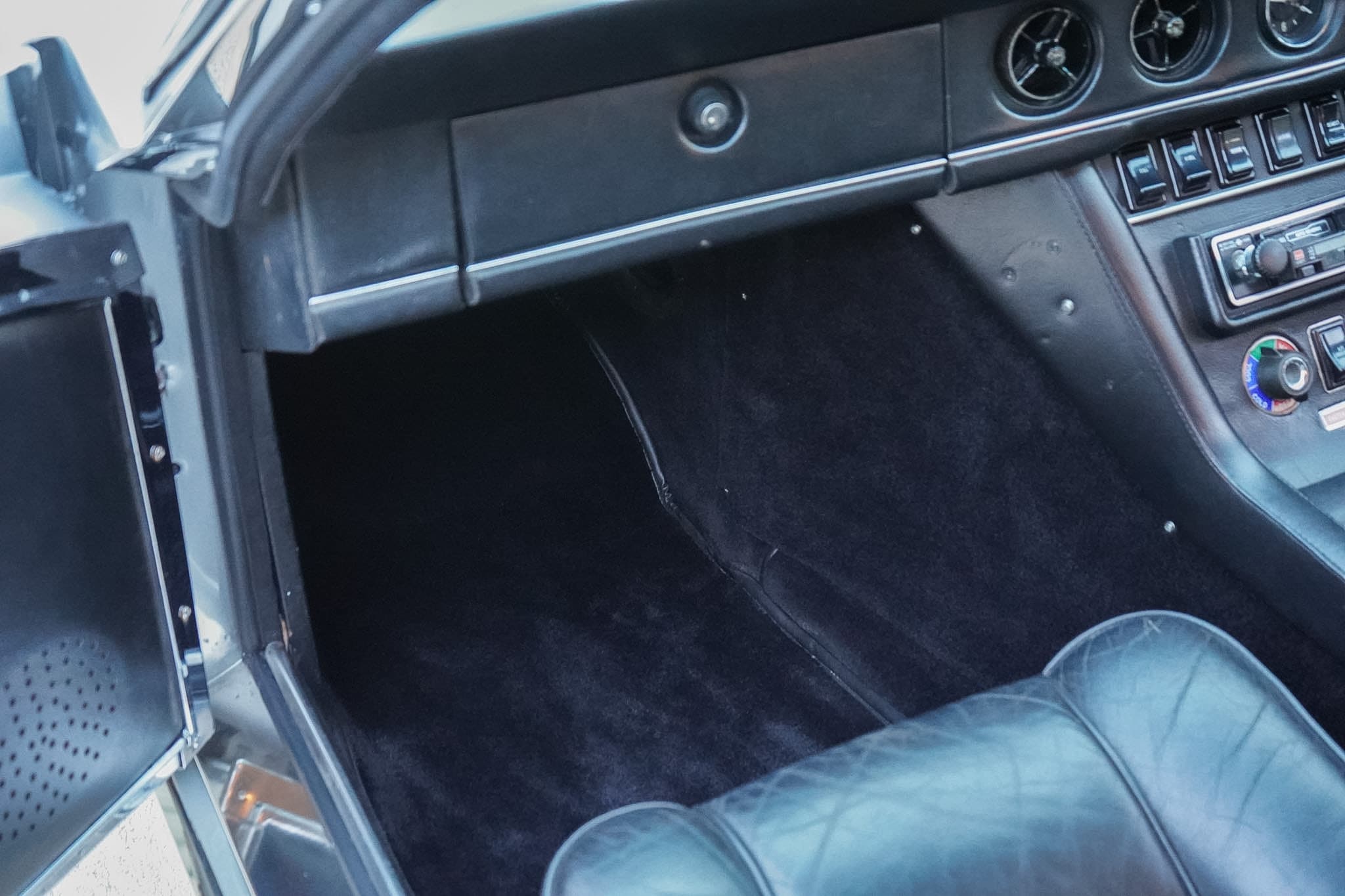Jensen Interceptor Mk III passenger footwell and lower-dashboard view.