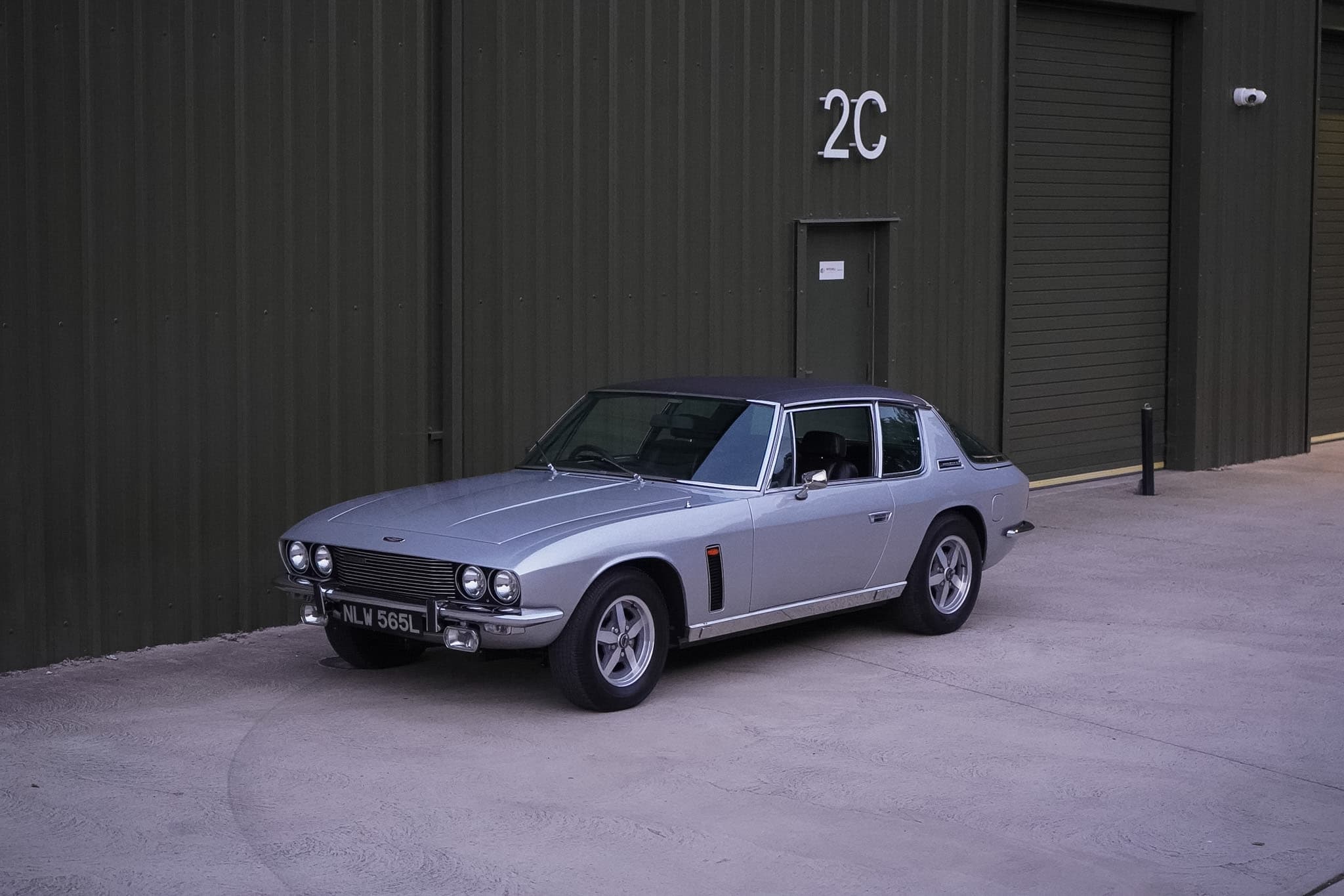 Silver Jensen Interceptor Mk III wide front three-quarter view.
